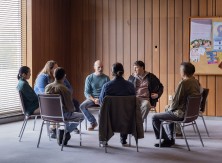 people sitting in a group setting 