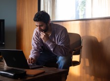 man looking at computer