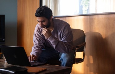 man looking at computer