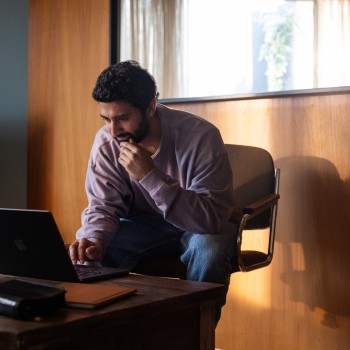 man looking at computer