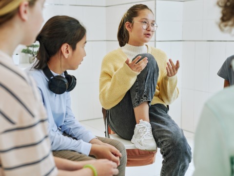 young person talking to a group