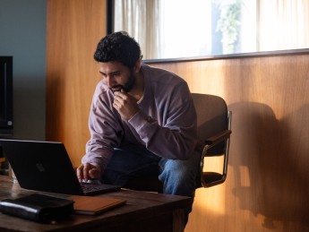 man looking at computer
