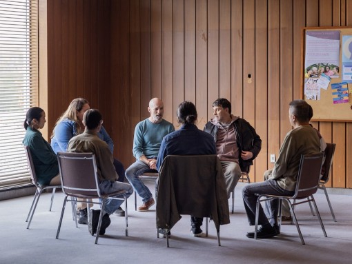 people sitting in a group setting 